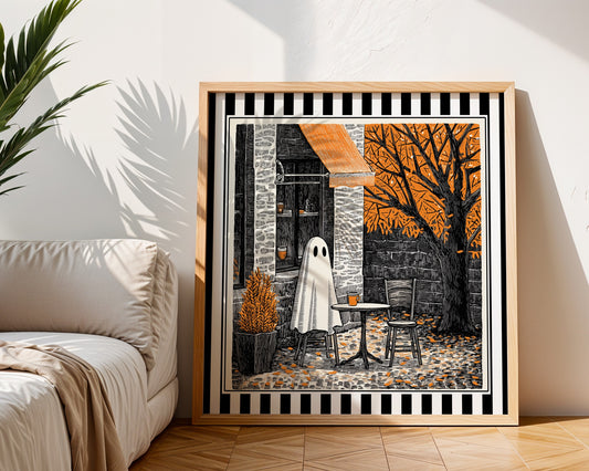 Autumn ghost café print displayed in a light wood square frame beside a neutral sofa