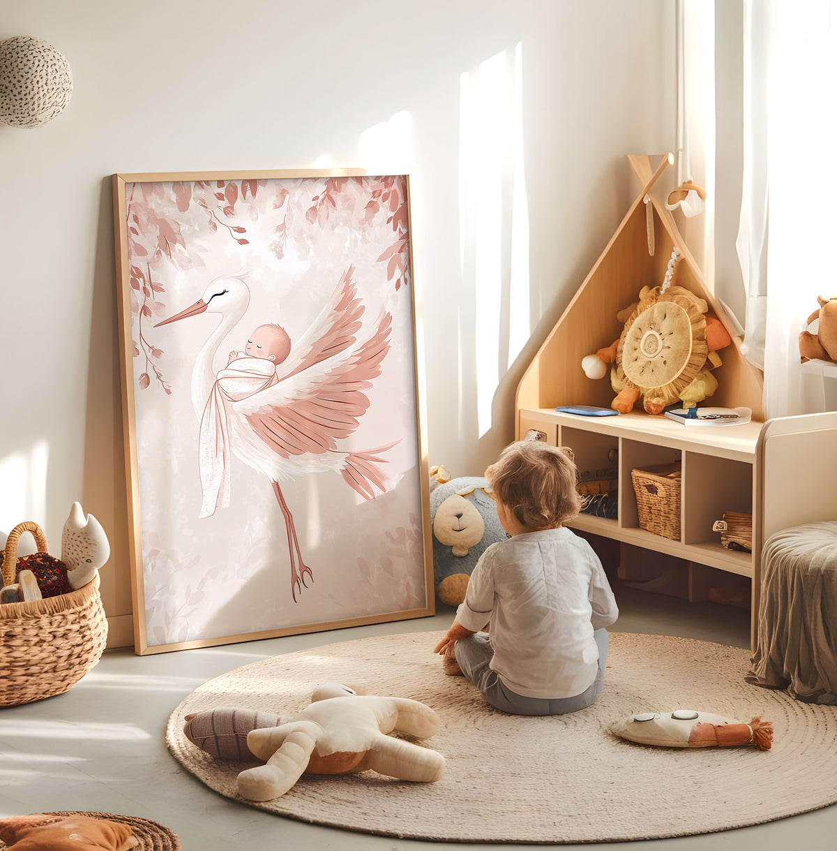 Pink stork and baby nursery print displayed in a bright child's room