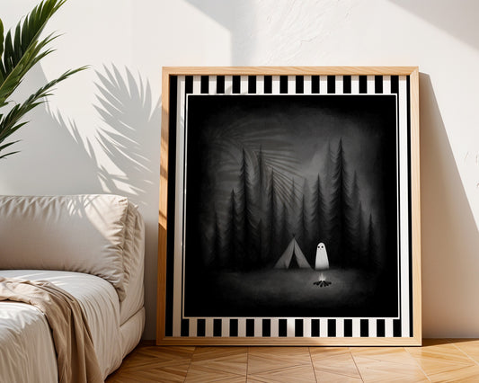Ghost camping gothic print displayed in a light wood frame in a living room
