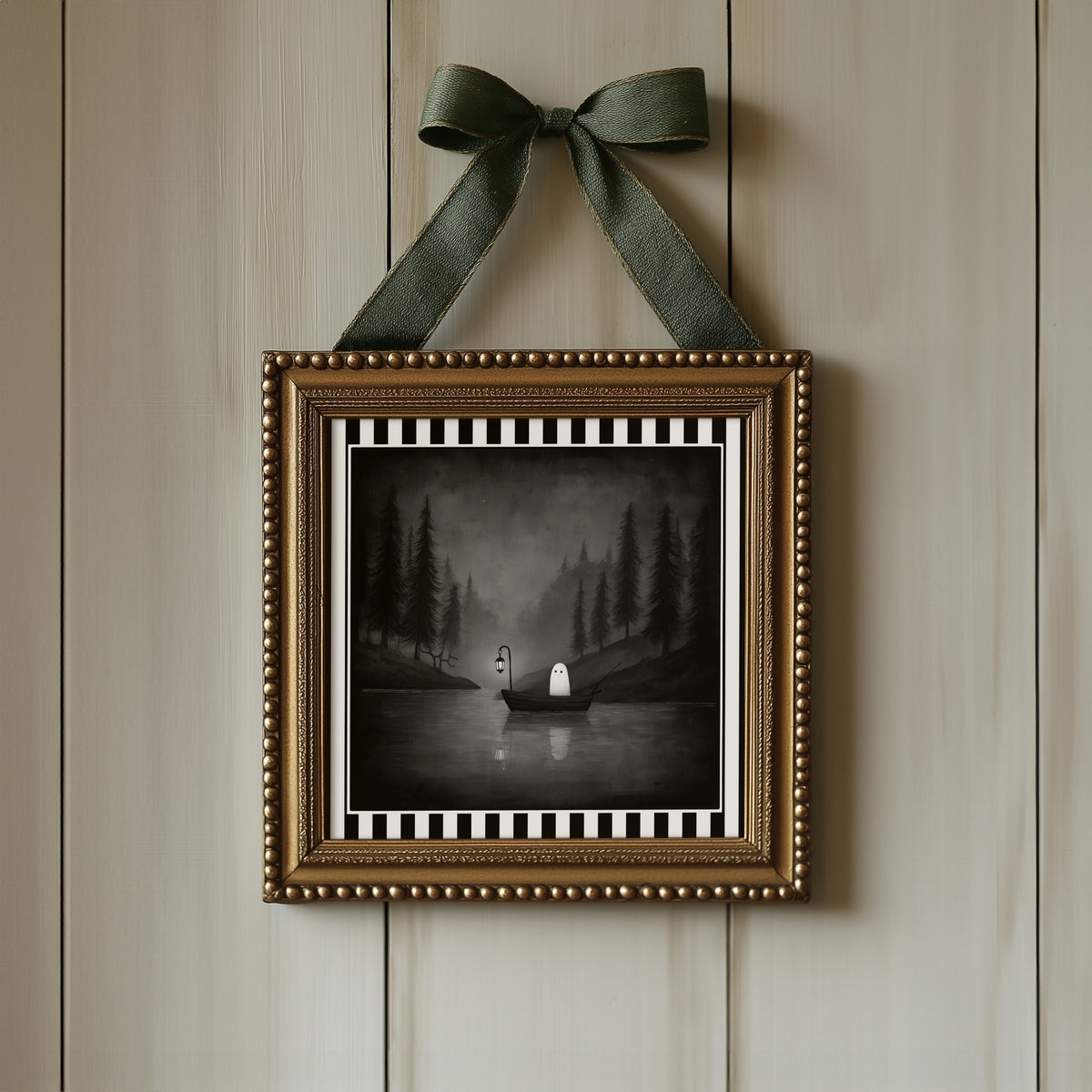 Ghost fishing gothic print displayed in an ornate gold frame with green ribbon