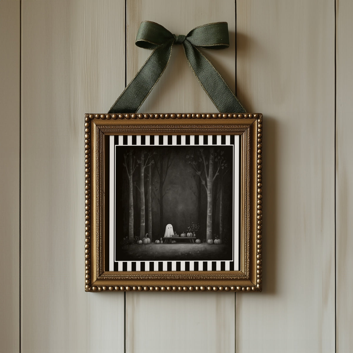 Ghost pumpkin picnic gothic print displayed in an ornate gold frame with green ribbon