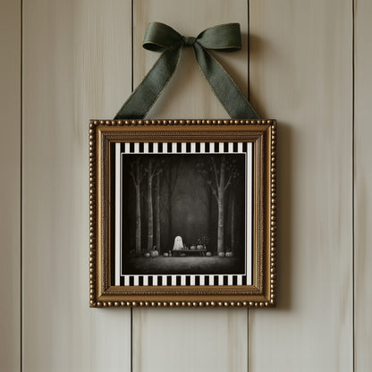 Ghost pumpkin picnic gothic print displayed in an ornate gold frame with green ribbon
