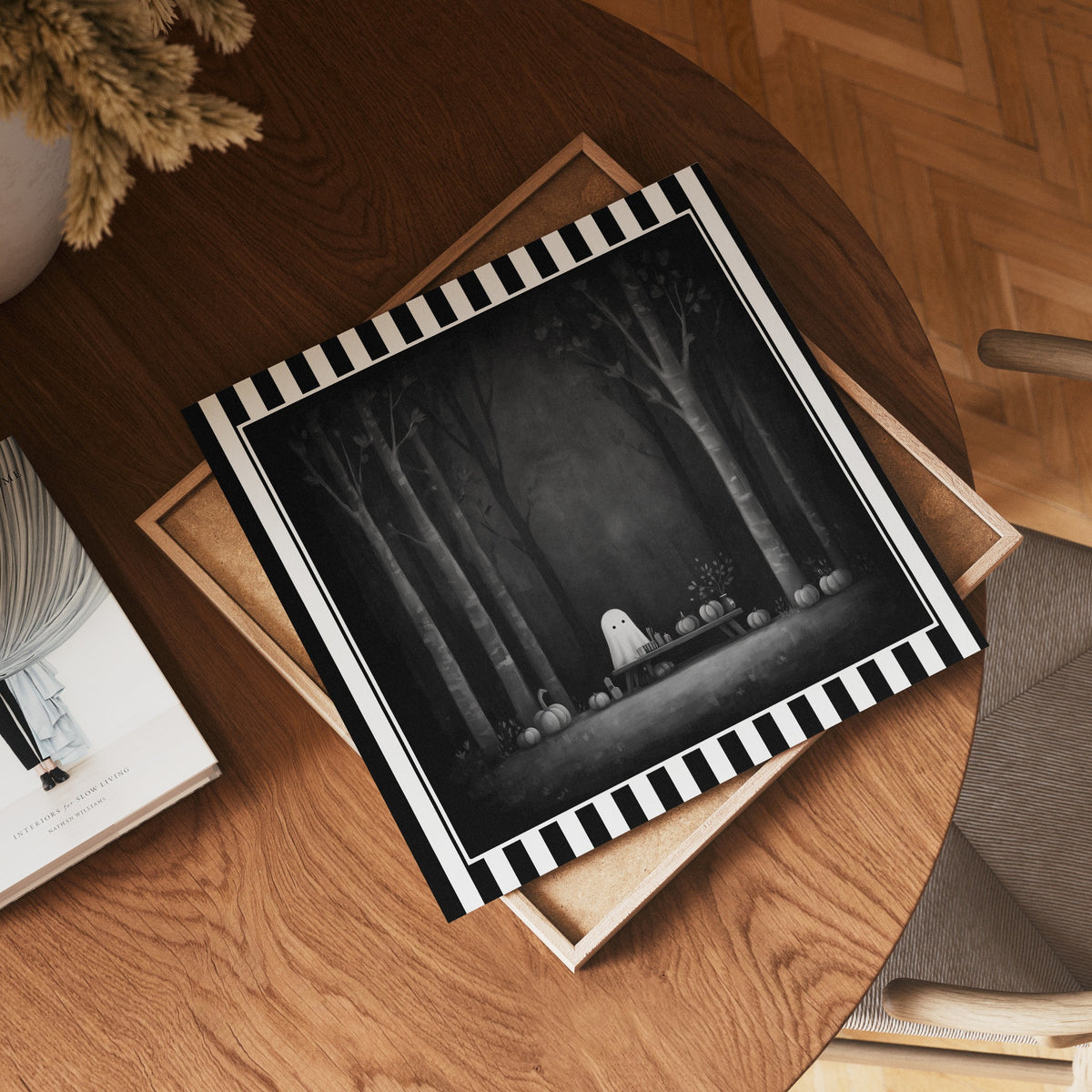 Ghost pumpkin picnic gothic print shown as a square print mockup on a wooden table