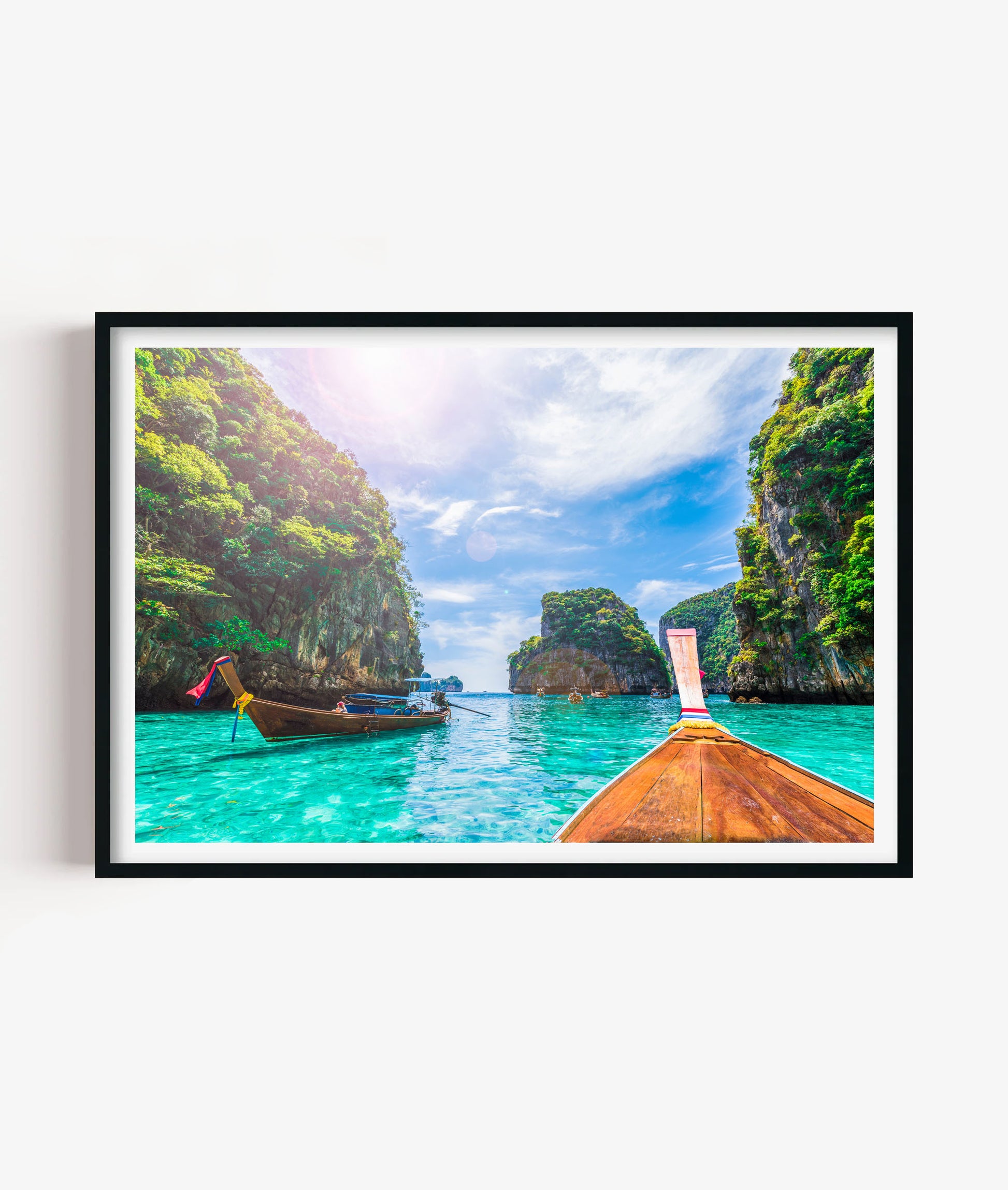 Bring a bright tropical coastal atmosphere to your space with this vibrant beach boat print, featuring turquoise ocean water, traditional wooden longtail boats, dramatic limestone cliffs, lush green island scenery and a sunny blue sky, perfect for bathrooms, bedrooms, living rooms, offices, beach houses and travel-inspired gallery walls.