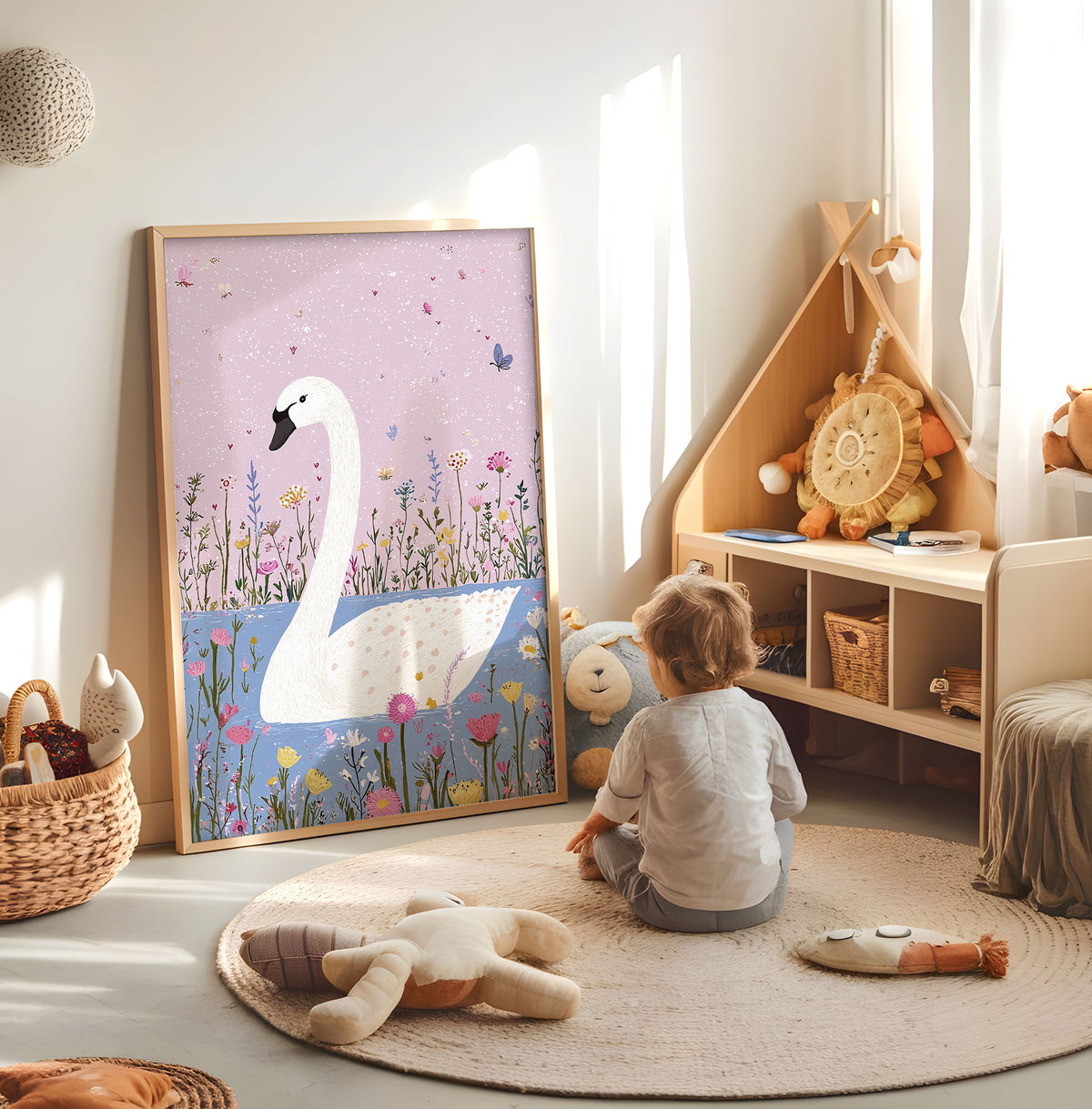 Pink and blue swan nursery print displayed in a bright child's room
