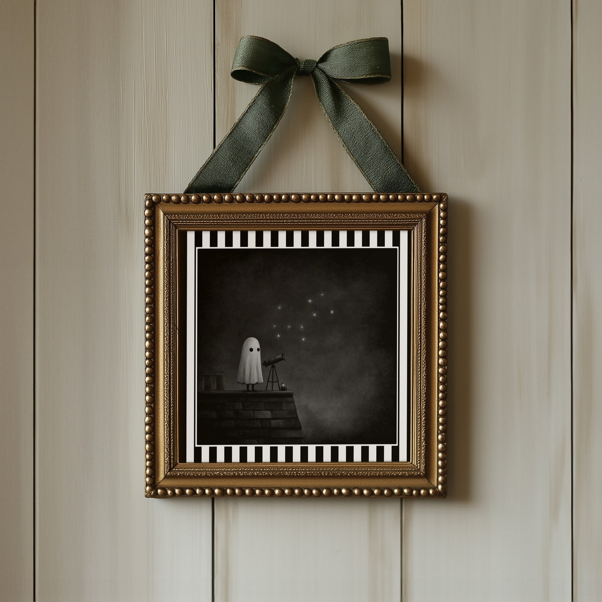 Ghost stargazing gothic print displayed in an ornate gold frame with green ribbon