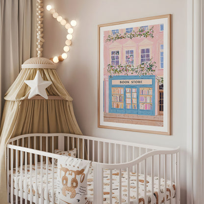 Pink and blue floral bookshop nursery wall art displayed above a cot