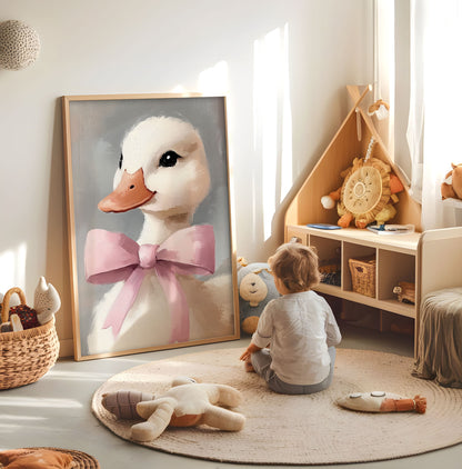 White duck with pink bow nursery wall art displayed in a bright child room
