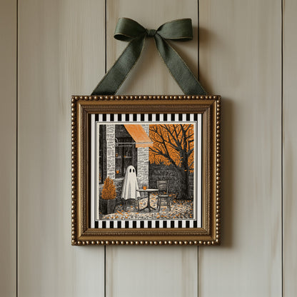 Autumn ghost café print displayed in an ornate gold square frame with ribbon