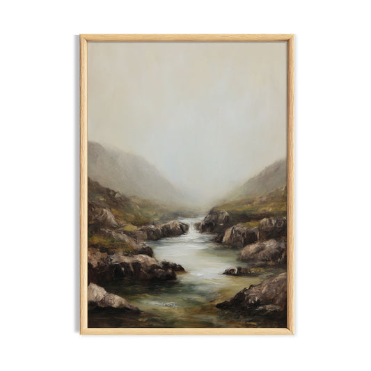 Gentle mountain stream flowing through a misty rocky valley.