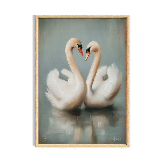 Pair of white swans facing each other with their necks forming a heart.