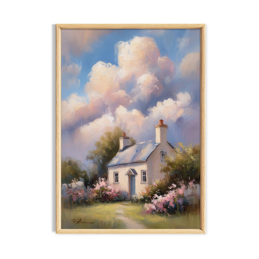 White country cottage surrounded by a colourful flower garden beneath large pastel clouds.