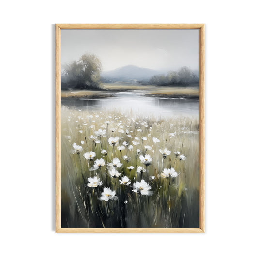 White daisies beside a calm lake with pale hills in the distance.