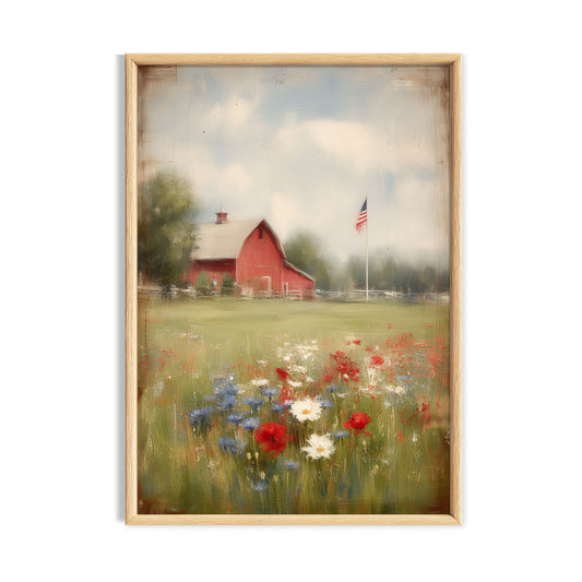 Red country barn beyond a colourful wildflower meadow beneath a pale sky.