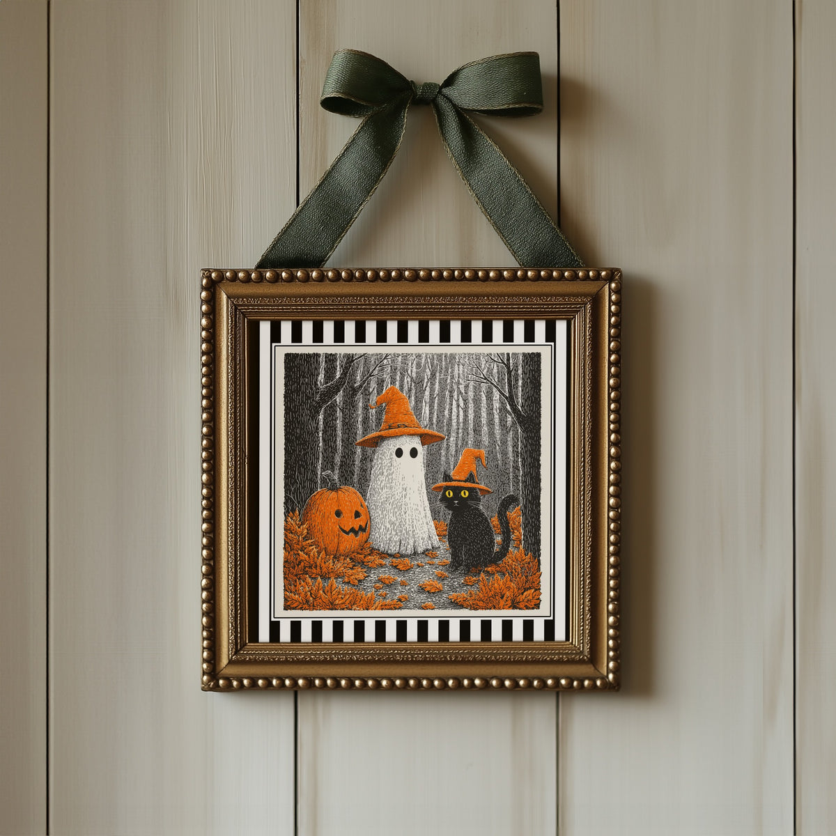 Ghost and black cat Halloween print displayed in an ornate gold square frame with ribbon