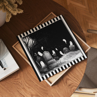 Square ghost graveyard print displayed flat on a wooden table