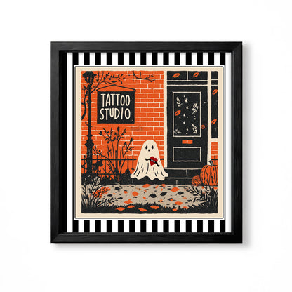 Orange and black tattoo studio storefront with a small white ghost and pumpkin