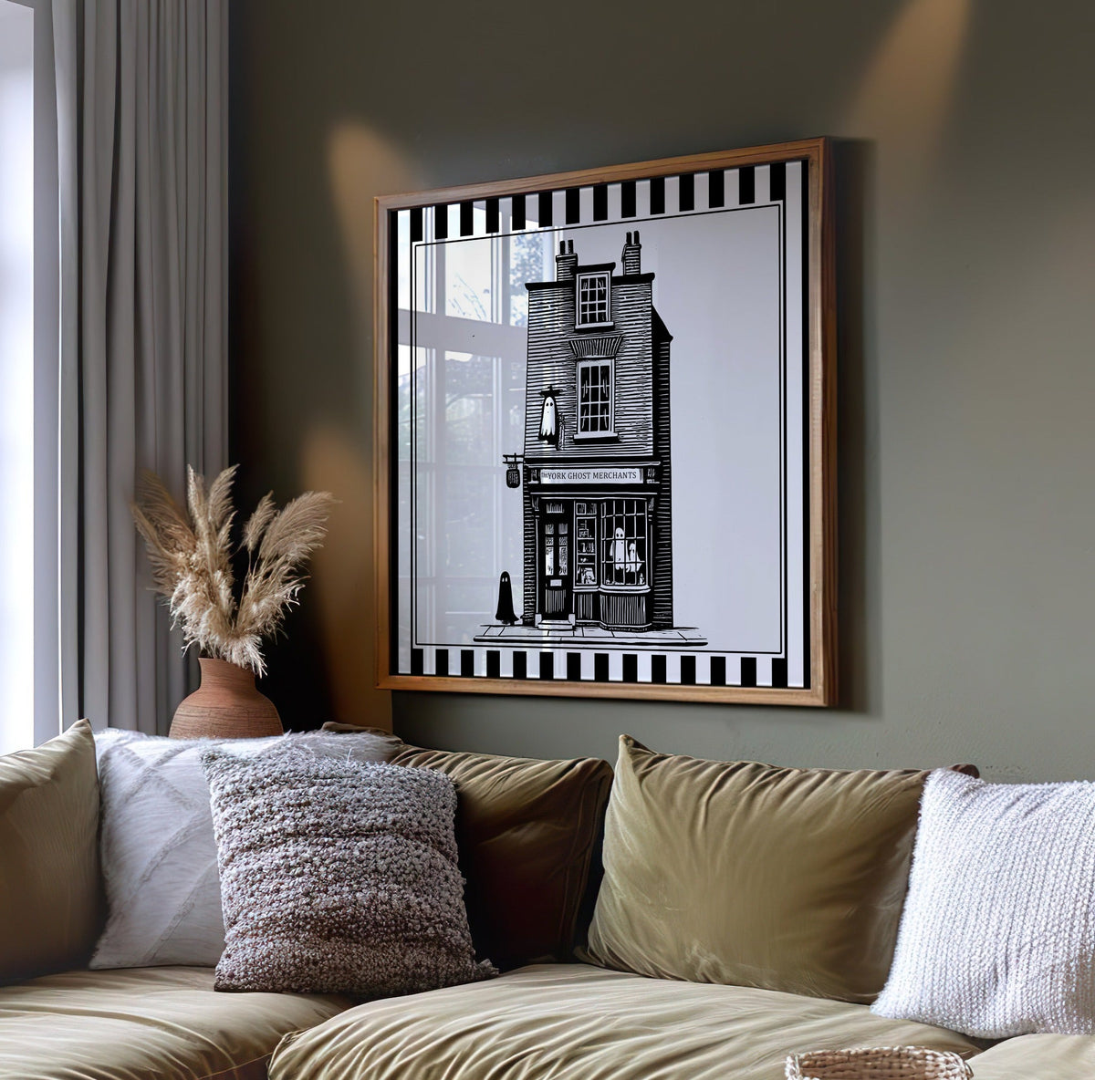York ghost shopfront wall art displayed on a dark green wall above a sofa