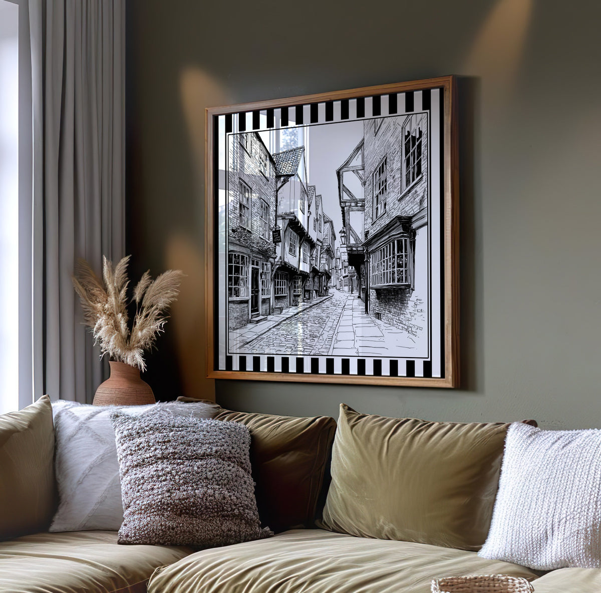 Black and white York Shambles street wall art displayed on a dark green wall above a sofa