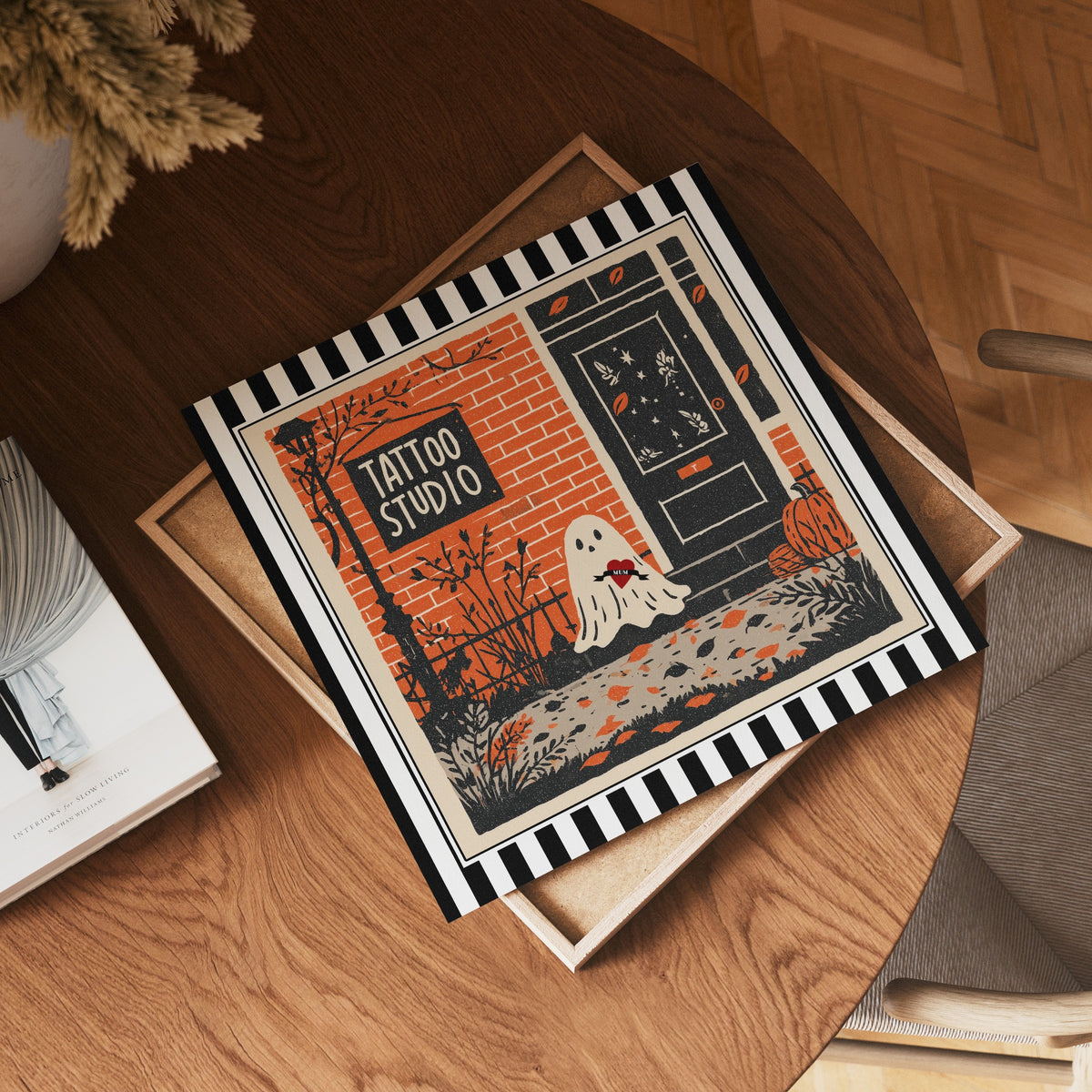 Square tattoo studio ghost print displayed flat on a wooden table