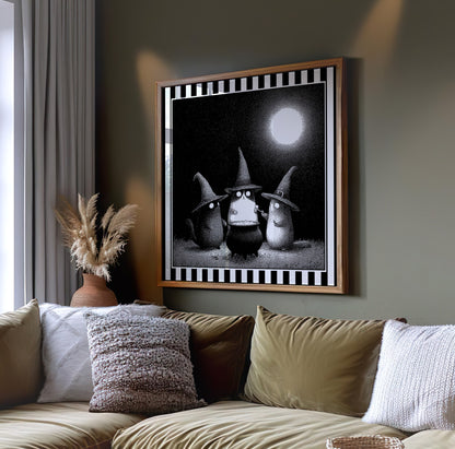 Witch cats moonlit wall art displayed on a dark green wall above a sofa